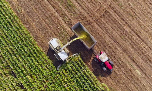 Tractor harvesting a field on a clear day